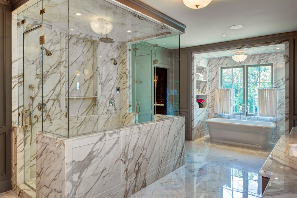 На фото: главная ванная комната в классическом стиле с отдельно стоящей ванной, двойным душем, мраморной плиткой, серыми стенами, мраморным полом, врезной раковиной, мраморной столешницей, белым полом и душем с распашными дверями