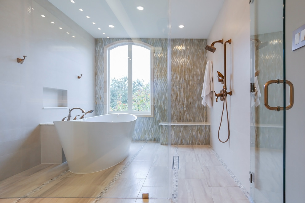 Inspiration for a large classic ensuite bathroom in Houston with a submerged sink, freestanding cabinets, white cabinets, marble worktops, a freestanding bath, a shower/bath combination, a two-piece toilet, grey tiles, grey walls, porcelain flooring, porcelain tiles, grey floors, a hinged door and grey worktops.