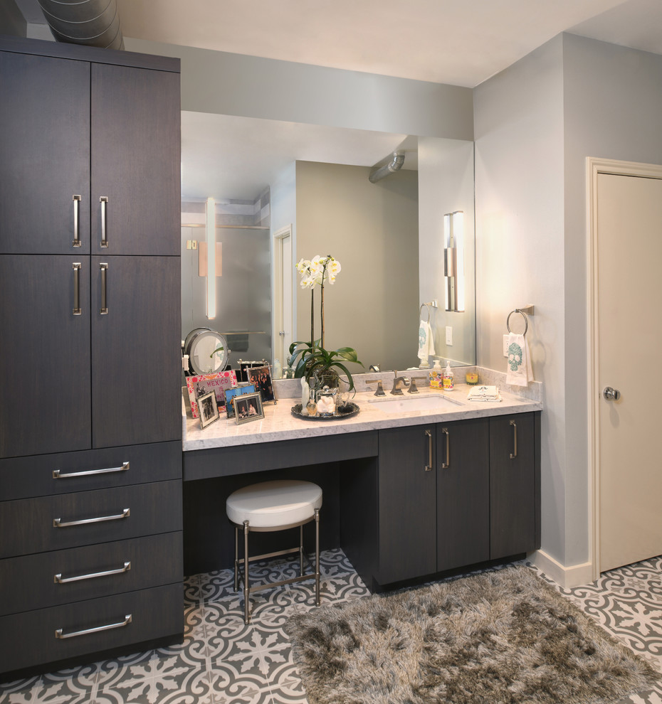 Walk-in shower - mid-sized contemporary master gray tile, multicolored tile and cement tile cement tile floor and multicolored floor walk-in shower idea in Houston with flat-panel cabinets, gray cabinets, gray walls, an undermount sink, a hinged shower door and gray countertops
