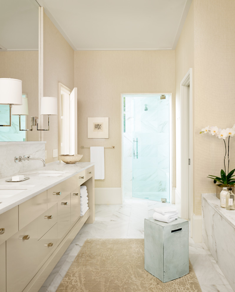 Inspiration for a traditional bathroom in Austin with a submerged sink, flat-panel cabinets, beige cabinets, an alcove shower and beige walls.