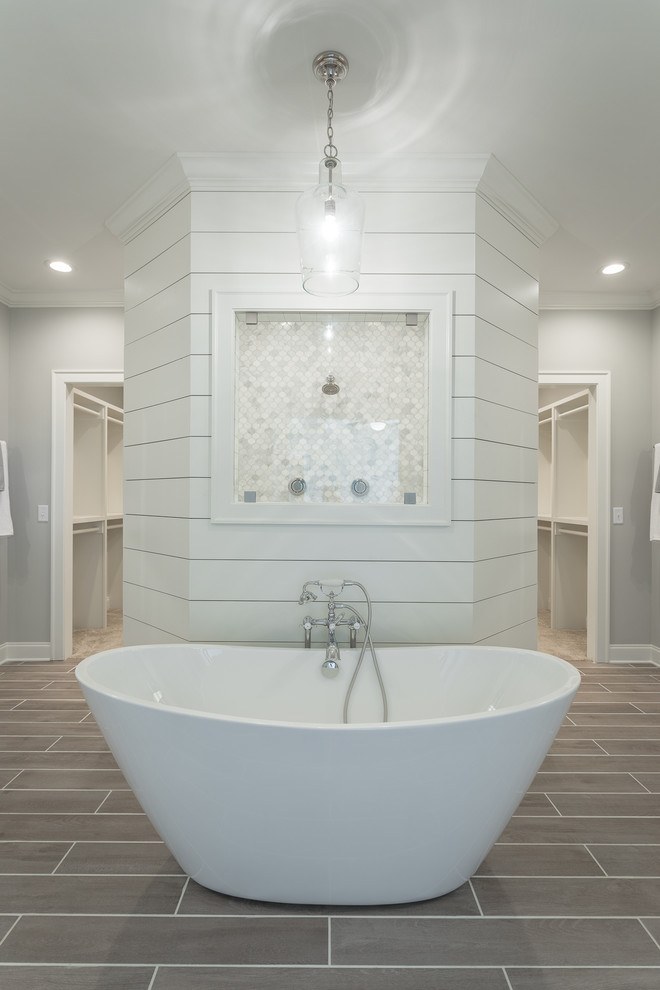 Farmhouse porcelain tile and brown floor bathroom photo in Other with shaker cabinets, white cabinets, a one-piece toilet, gray walls, an undermount sink and granite countertops