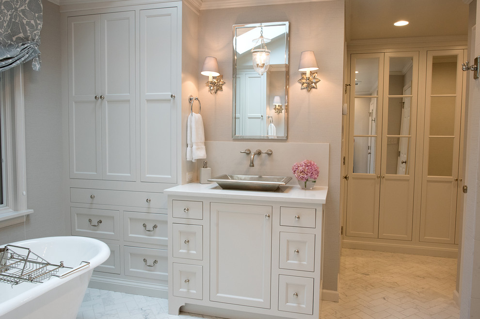 Photo of an expansive classic ensuite bathroom in Philadelphia with recessed-panel cabinets, white cabinets, a freestanding bath, an alcove shower, a one-piece toilet, white tiles, porcelain tiles, blue walls, ceramic flooring, a vessel sink, engineered stone worktops, white floors and a hinged door.