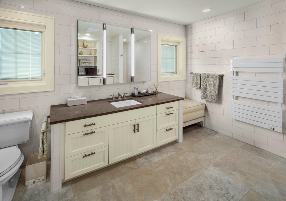 Example of a mid-sized minimalist master white tile and subway tile limestone floor bathroom design in Other with an undermount sink, beaded inset cabinets, white cabinets, granite countertops and white walls