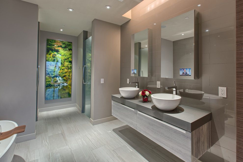 Large minimalist master porcelain tile and gray floor bathroom photo in Other with flat-panel cabinets, gray cabinets, gray walls, a vessel sink, a hinged shower door and gray countertops