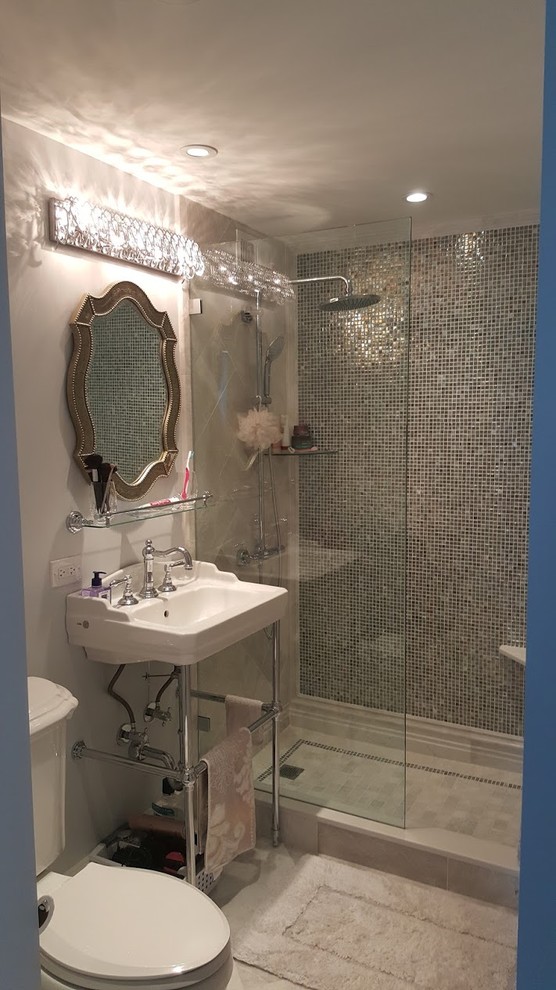 Mid-sized trendy 3/4 gray tile, multicolored tile, white tile and mosaic tile ceramic tile doorless shower photo in Chicago with open cabinets, a two-piece toilet, a wall-mount sink, solid surface countertops and gray walls