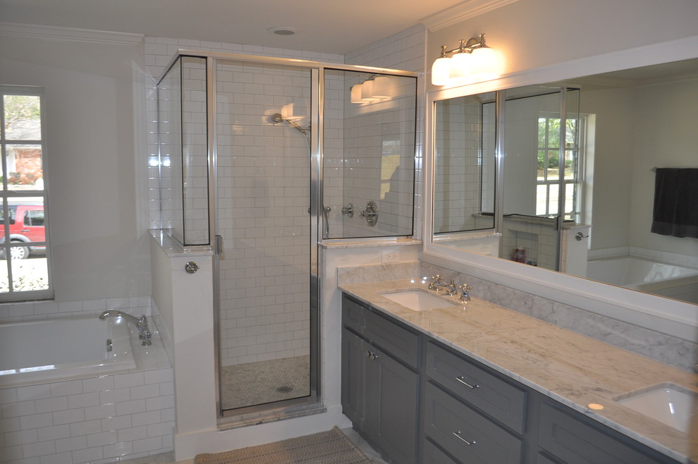 Classic ensuite bathroom in Dallas with shaker cabinets, grey cabinets, a built-in bath, a corner shower, a two-piece toilet, white tiles, ceramic tiles, grey walls, marble flooring and a submerged sink.