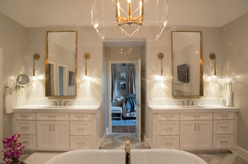 Inspiration for a large transitional master white tile and glass tile limestone floor and multicolored floor bathroom remodel in Charlotte with recessed-panel cabinets, white cabinets, a two-piece toilet, beige walls, an undermount sink, marble countertops and a hinged shower door