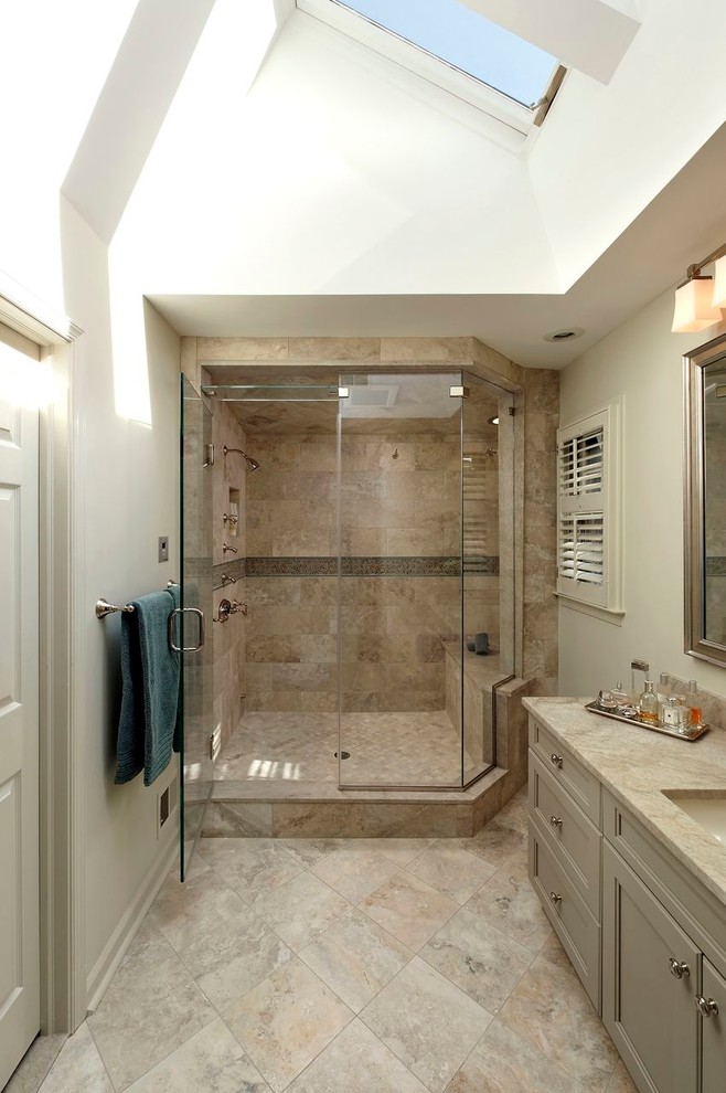 Corner shower - large traditional master multicolored tile and stone tile travertine floor corner shower idea in DC Metro with an undermount sink, recessed-panel cabinets, green cabinets, granite countertops, a one-piece toilet and white walls