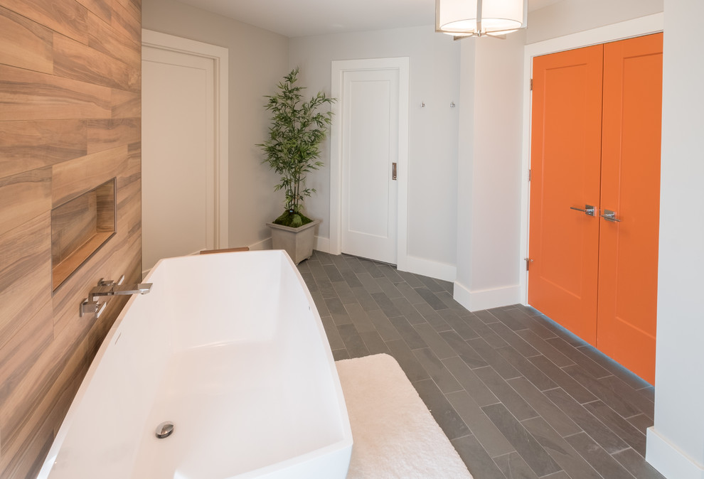 Example of a large minimalist master brown tile and porcelain tile slate floor and gray floor bathroom design in Detroit with flat-panel cabinets, white cabinets, gray walls, an undermount sink, quartzite countertops and a hinged shower door