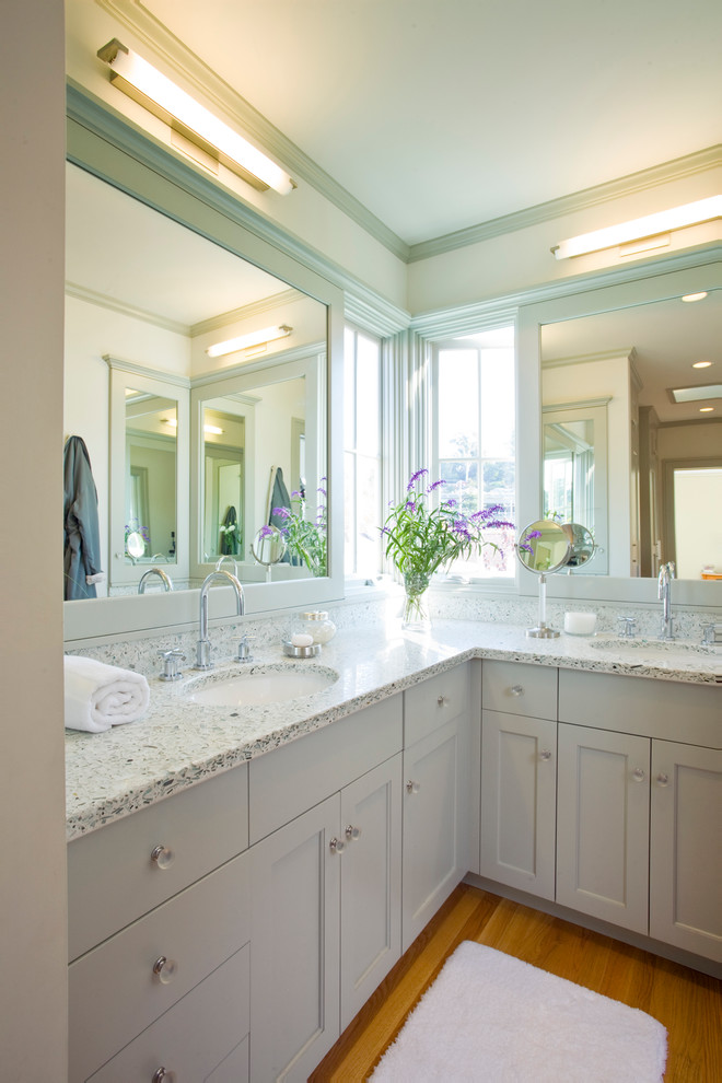 Inspiration for a medium sized traditional ensuite bathroom in San Francisco with recessed-panel cabinets, white cabinets, medium hardwood flooring, a submerged sink and engineered stone worktops.