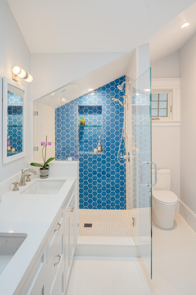 Example of a large transitional 3/4 stone tile and blue tile white floor alcove shower design in San Francisco with white walls, an undermount sink, quartzite countertops, white countertops, shaker cabinets, white cabinets, a two-piece toilet and a hinged shower door