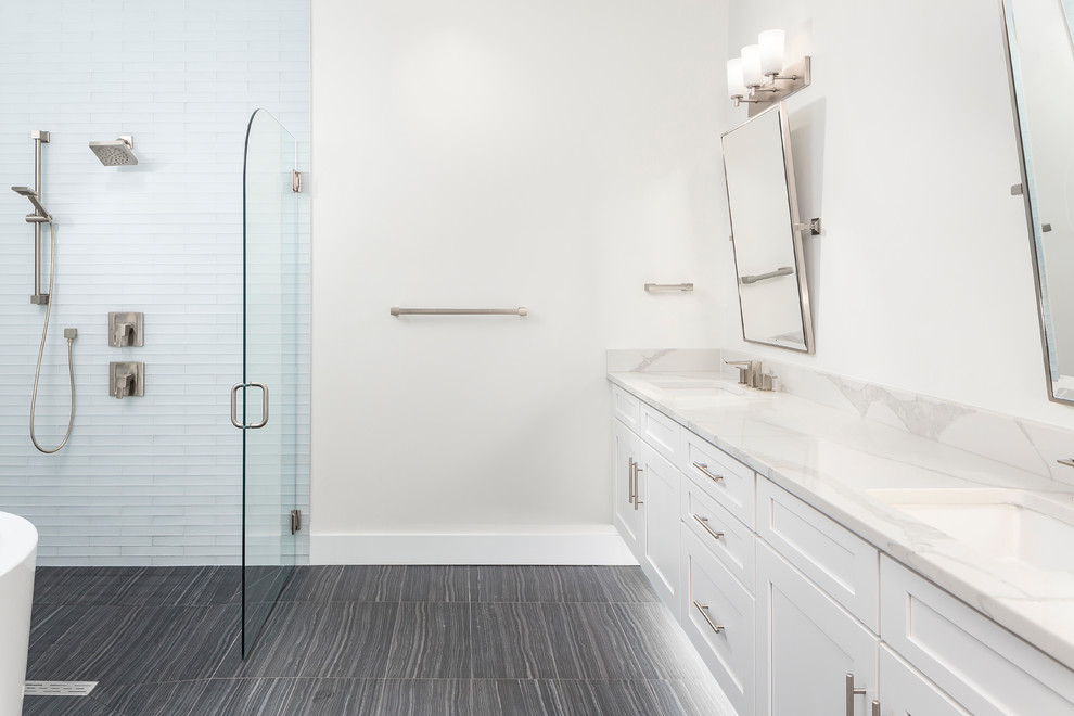 Inspiration for a modern ensuite bathroom in Orlando with shaker cabinets, white cabinets, a japanese bath, an alcove shower, white tiles, metro tiles, white walls, porcelain flooring, a submerged sink, quartz worktops and a hinged door.