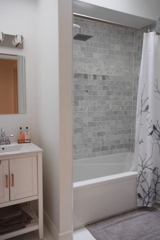 Mid-sized trendy kids' white tile and stone tile drop-in bathtub photo in Toronto with shaker cabinets, white cabinets, a one-piece toilet, white walls, an undermount sink and quartz countertops