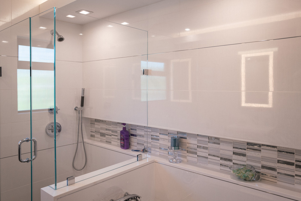 Example of a large minimalist kids' white tile and porcelain tile porcelain tile and gray floor corner shower design in Los Angeles with glass-front cabinets, gray cabinets, a hot tub, a one-piece toilet, white walls, an undermount sink, quartz countertops, a hinged shower door and white countertops