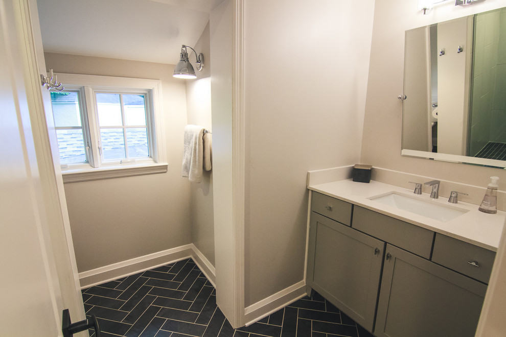 Design ideas for a large classic family bathroom in Baltimore with shaker cabinets, grey cabinets, an alcove shower, a two-piece toilet, grey tiles, ceramic tiles, beige walls, ceramic flooring, a submerged sink, marble worktops, blue floors and a hinged door.