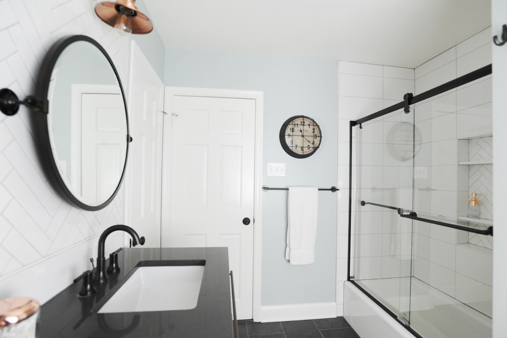 Example of a mid-sized urban master white tile and porcelain tile ceramic tile and gray floor bathroom design in Baltimore with flat-panel cabinets, light wood cabinets, a two-piece toilet, green walls, an undermount sink, granite countertops and gray countertops