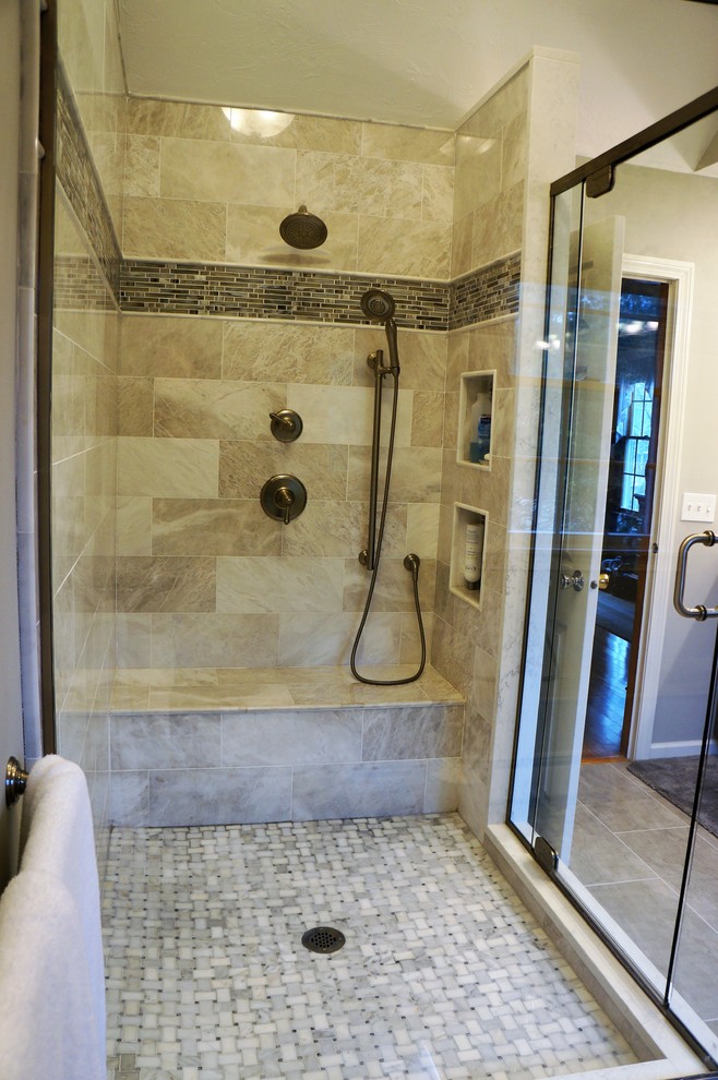 This is an example of a medium sized modern ensuite bathroom in Boston with recessed-panel cabinets, brown cabinets, a corner shower, beige tiles, ceramic tiles, beige walls, ceramic flooring, a submerged sink, engineered stone worktops and a hinged door.