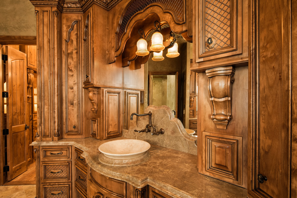 Photo of a medium sized rustic ensuite bathroom in Dallas with raised-panel cabinets, medium wood cabinets, an alcove shower, a two-piece toilet, beige tiles, ceramic tiles, green walls, medium hardwood flooring, a vessel sink and granite worktops.