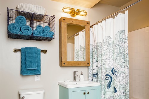 Nautical Sophistication: Blue Vanity and Wood Medicine Cabinet with Bathroom Curtain Ideas