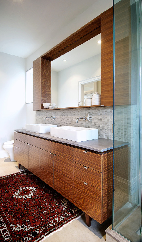 This is an example of a large modern ensuite bathroom in Toronto with concrete worktops, flat-panel cabinets, medium wood cabinets, white walls, a vessel sink and beige floors.