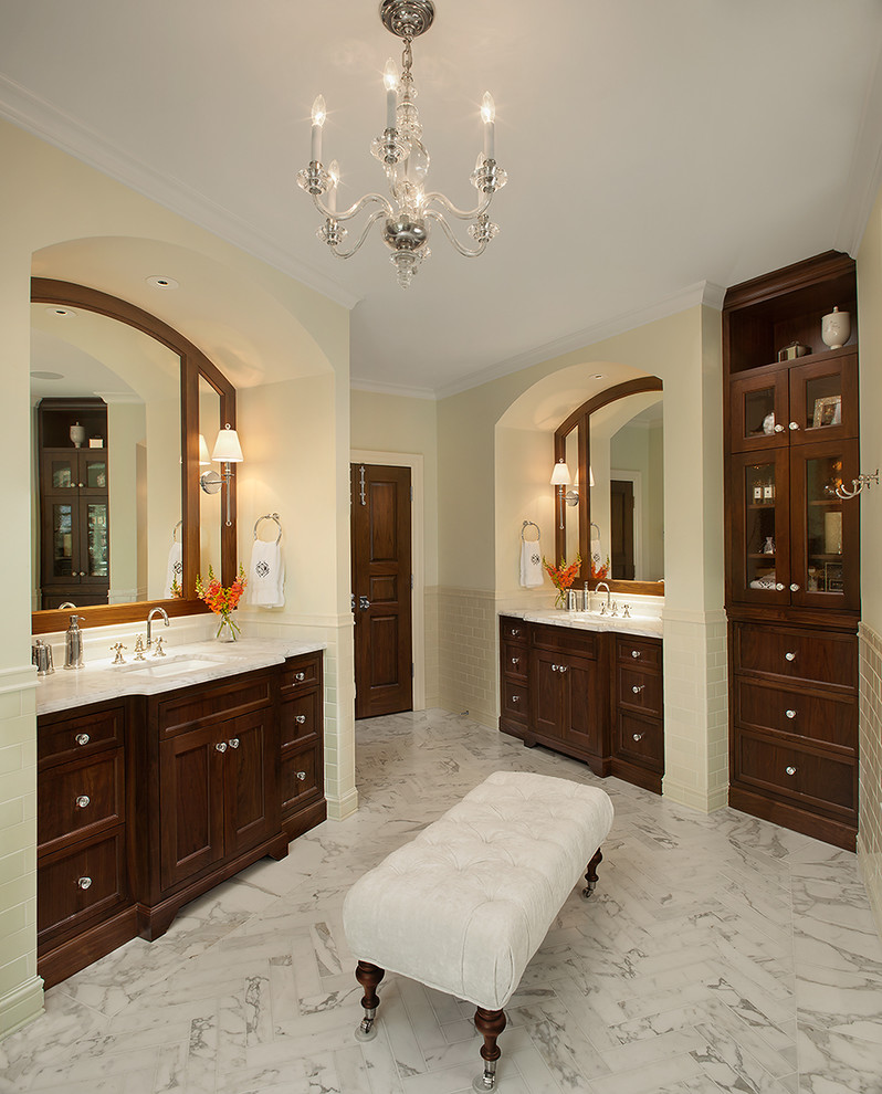 Expansive traditional ensuite bathroom in Grand Rapids with a submerged sink, recessed-panel cabinets, dark wood cabinets, marble worktops, an alcove shower, a one-piece toilet, white tiles, green walls, a freestanding bath, multi-coloured worktops, metro tiles, porcelain flooring, multi-coloured floors and a hinged door.
