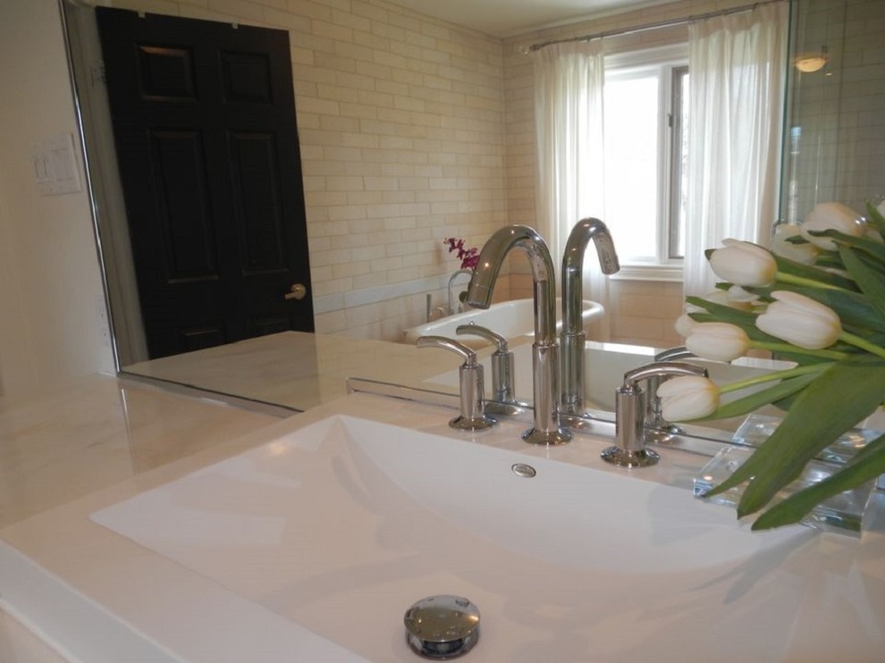 Mid-sized trendy master beige tile, white tile and ceramic tile ceramic tile bathroom photo in Toronto with shaker cabinets, white cabinets, quartzite countertops, a two-piece toilet, white walls and a trough sink