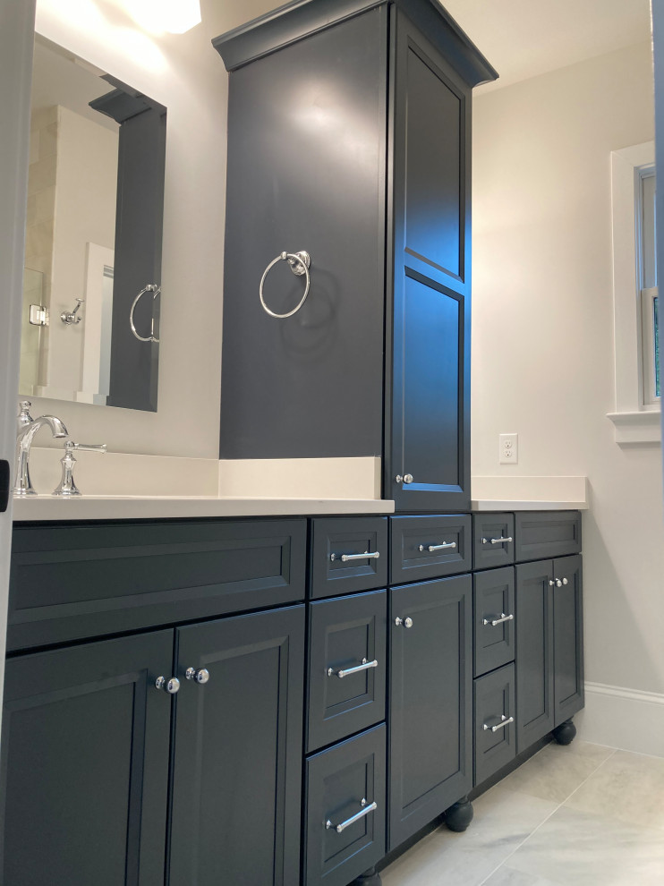 Inspiration for a medium sized classic ensuite bathroom in DC Metro with recessed-panel cabinets, blue cabinets, grey walls, a submerged sink, engineered stone worktops, white worktops, double sinks, a built in vanity unit, marble flooring and white floors.