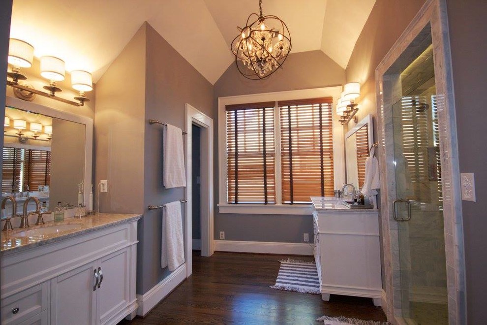 Example of a mid-sized arts and crafts master gray tile medium tone wood floor bathroom design in Atlanta with white cabinets, marble countertops and gray walls