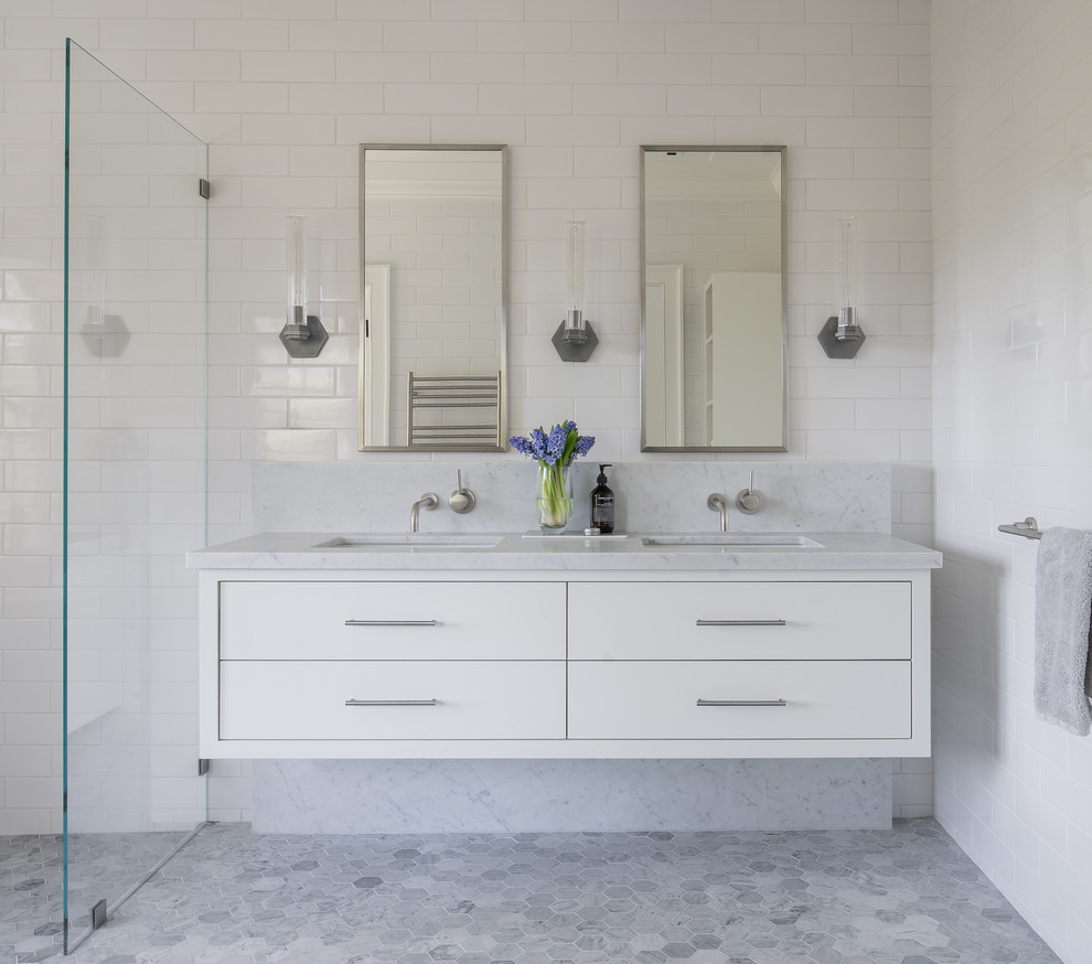 Design ideas for a large contemporary ensuite wet room bathroom in San Francisco with flat-panel cabinets, white cabinets, white tiles, white walls, mosaic tile flooring, a submerged sink, grey floors, an open shower, grey worktops, metro tiles, marble worktops and a freestanding bath.