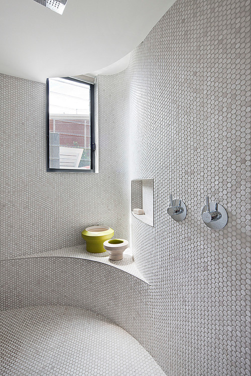 White Penny Tiles with Built-in Bench