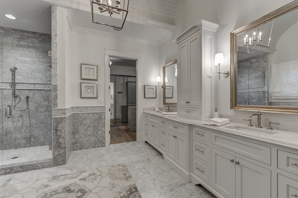 Huge elegant master white tile and stone tile marble floor freestanding bathtub photo in Atlanta with an undermount sink, shaker cabinets, white cabinets, marble countertops, a one-piece toilet and gray walls