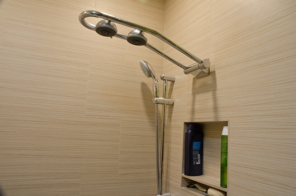 This is an example of a medium sized contemporary ensuite bathroom in Minneapolis with a built-in sink, recessed-panel cabinets, dark wood cabinets, laminate worktops, a built-in bath, a shower/bath combination, a two-piece toilet, beige tiles, ceramic tiles, green walls and porcelain flooring.