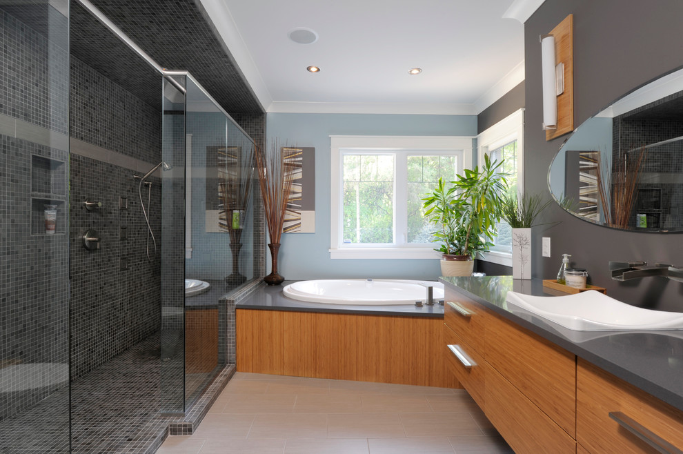 Design ideas for a contemporary bathroom in Toronto with a built-in sink, medium wood cabinets, a built-in bath, a walk-in shower, grey tiles, mosaic tiles, an open shower and grey worktops.