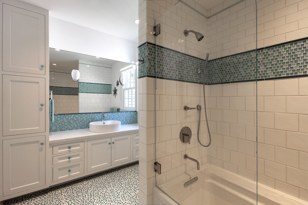 Mid-sized transitional blue tile and mosaic tile pebble tile floor bathroom photo in New York with a vessel sink, shaker cabinets, white cabinets, quartz countertops, a one-piece toilet and white walls