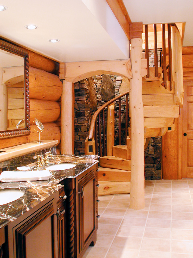 На фото: огромная главная ванная комната в стиле кантри с накладной раковиной, фасадами островного типа, темными деревянными фасадами, столешницей из гранита и полом из керамической плитки с
