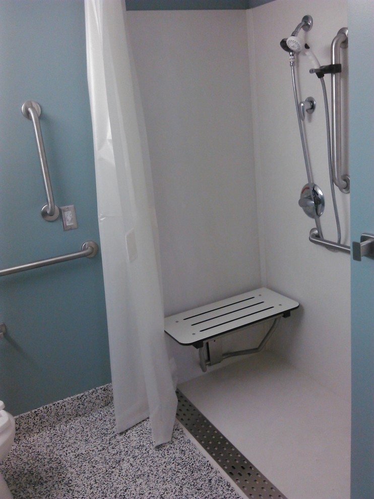 Example of a large classic master marble floor walk-in shower design in Other