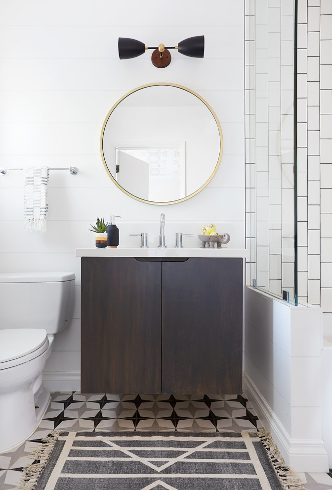 Inspiration for a contemporary shower room bathroom in Los Angeles with flat-panel cabinets, dark wood cabinets, a shower/bath combination, a one-piece toilet, white walls, mosaic tile flooring, grey floors, white worktops, a single sink and a floating vanity unit.