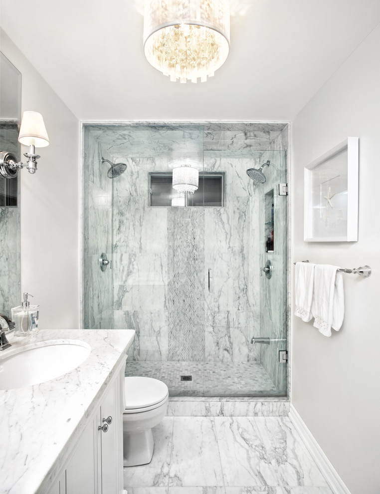 Example of a mid-sized transitional master white tile and stone tile marble floor double shower design in Toronto with an undermount sink, furniture-like cabinets, white cabinets, marble countertops and white walls