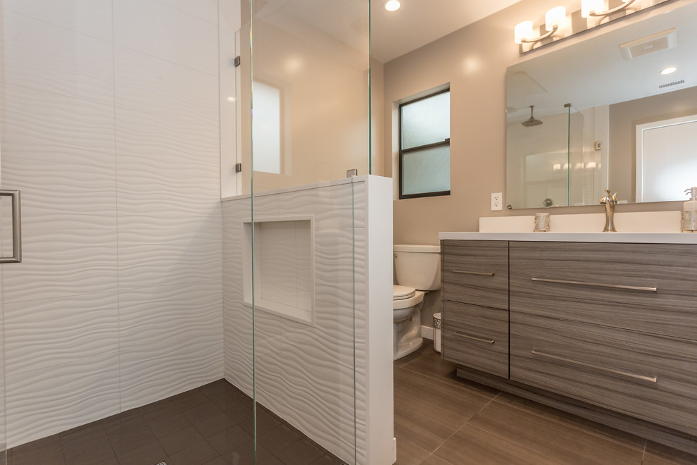 Mid-sized trendy 3/4 white tile and porcelain tile porcelain tile walk-in shower photo in Los Angeles with flat-panel cabinets, medium tone wood cabinets, a two-piece toilet, gray walls, an undermount sink and quartz countertops