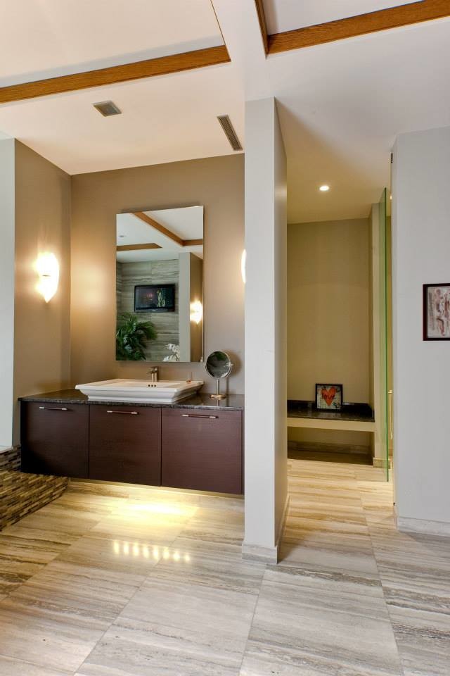 Inspiration for a huge contemporary master beige tile, brown tile, gray tile, multicolored tile and stone slab marble floor bathroom remodel in Detroit with flat-panel cabinets, dark wood cabinets, a two-piece toilet, gray walls, a vessel sink and granite countertops