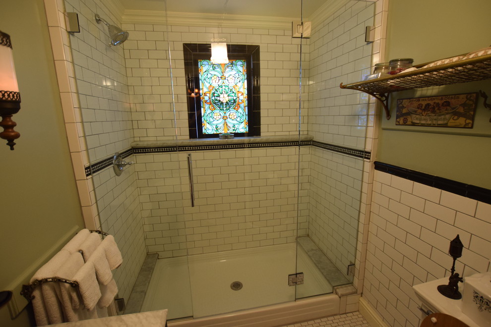Mid-sized ornate 3/4 ceramic tile and white floor alcove shower photo in New York with a two-piece toilet, gray walls and a hinged shower door