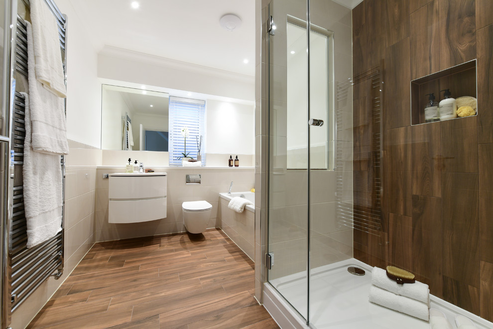 This is an example of a bathroom in London with beige tiles, porcelain tiles, porcelain flooring and brown floors.