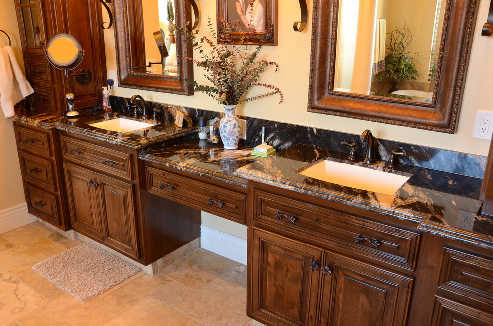 Inspiration for a mid-sized mediterranean master bathroom remodel in Other with an undermount sink, beaded inset cabinets, medium tone wood cabinets and granite countertops