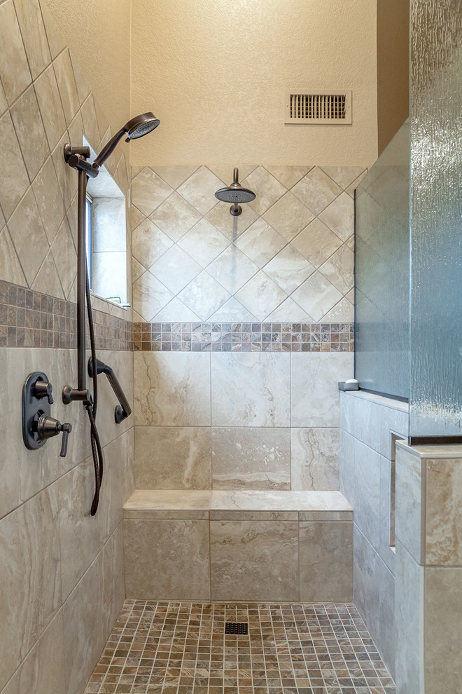 Medium sized classic ensuite bathroom in Phoenix with recessed-panel cabinets, medium wood cabinets, a corner shower, a one-piece toilet, beige tiles, porcelain tiles, beige walls, laminate floors, a submerged sink, granite worktops, brown floors and an open shower.