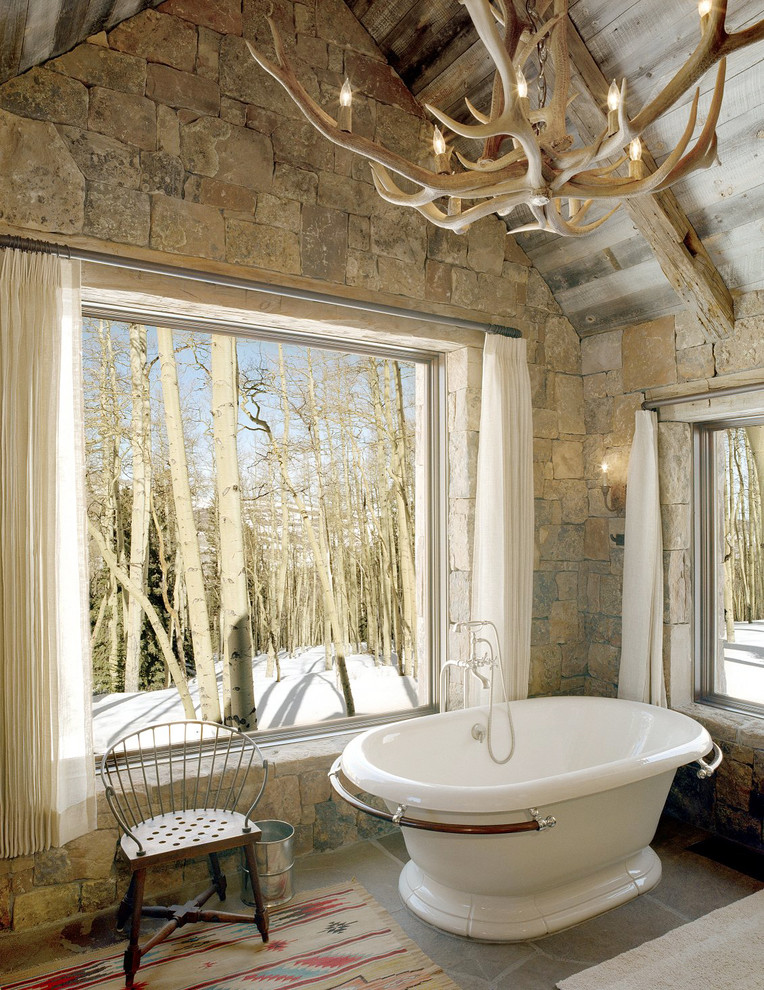 Inspiration for a rustic freestanding bathtub remodel in Other