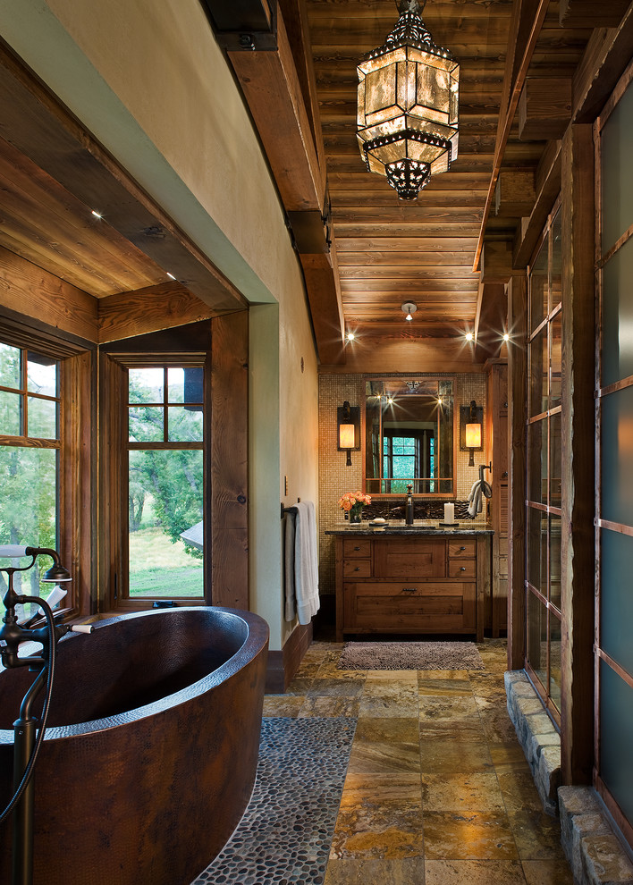 Japanese bathtub - rustic pebble tile floor japanese bathtub idea in Other