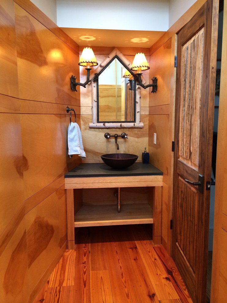 Example of a mid-sized mountain style medium tone wood floor bathroom design in Boston with a vessel sink