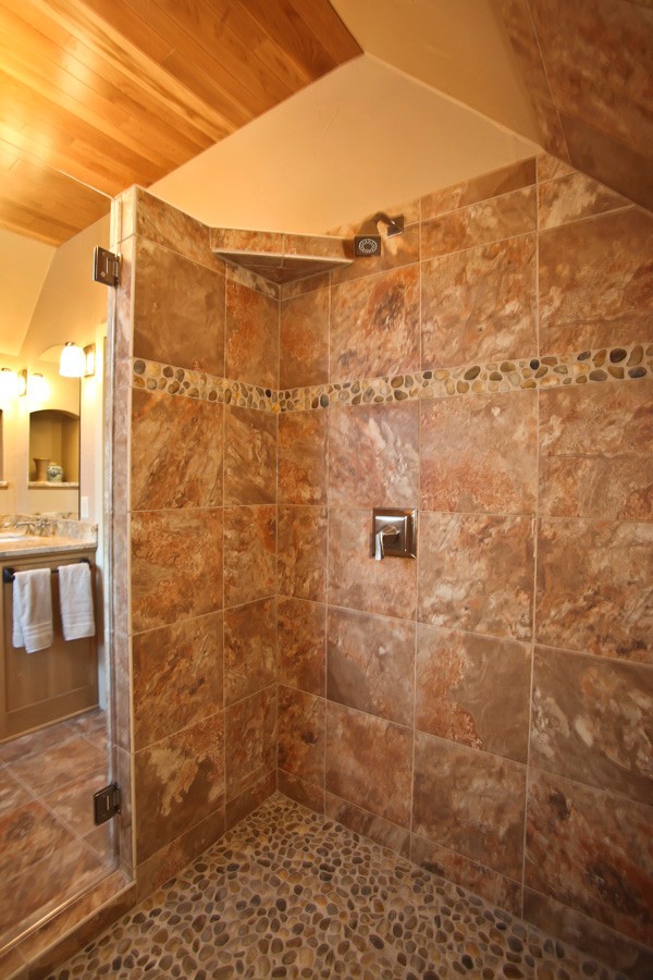 Cette image montre une salle de bain design en bois brun avec un plan vasque, un placard à porte shaker, un plan de toilette en granite, WC séparés, un carrelage beige, des carreaux en terre cuite, un mur beige et tomettes au sol.