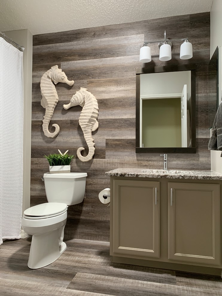 Foto di una stanza da bagno con doccia costiera di medie dimensioni con ante con riquadro incassato, ante grigie, pavimento in vinile, lavabo sottopiano, top in granito, pavimento grigio e top grigio