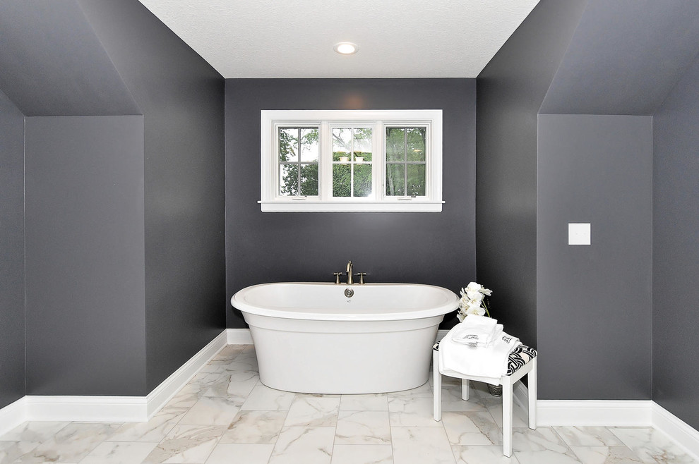 Large trendy master marble floor and white floor freestanding bathtub photo in Minneapolis with gray walls